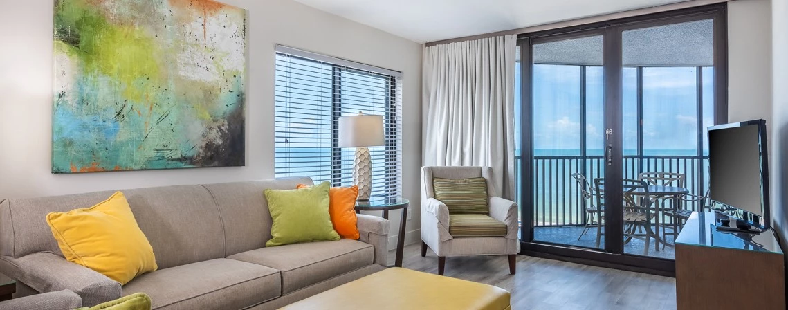 a living room with a couch and chairs