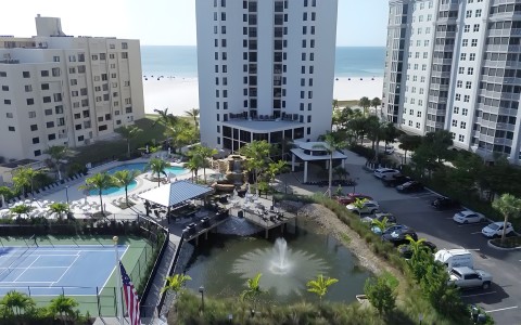 a building with a pool and a fountain