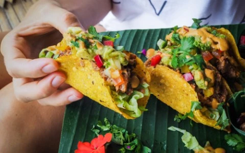 woman eating tacos