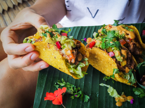 woman eating tacos