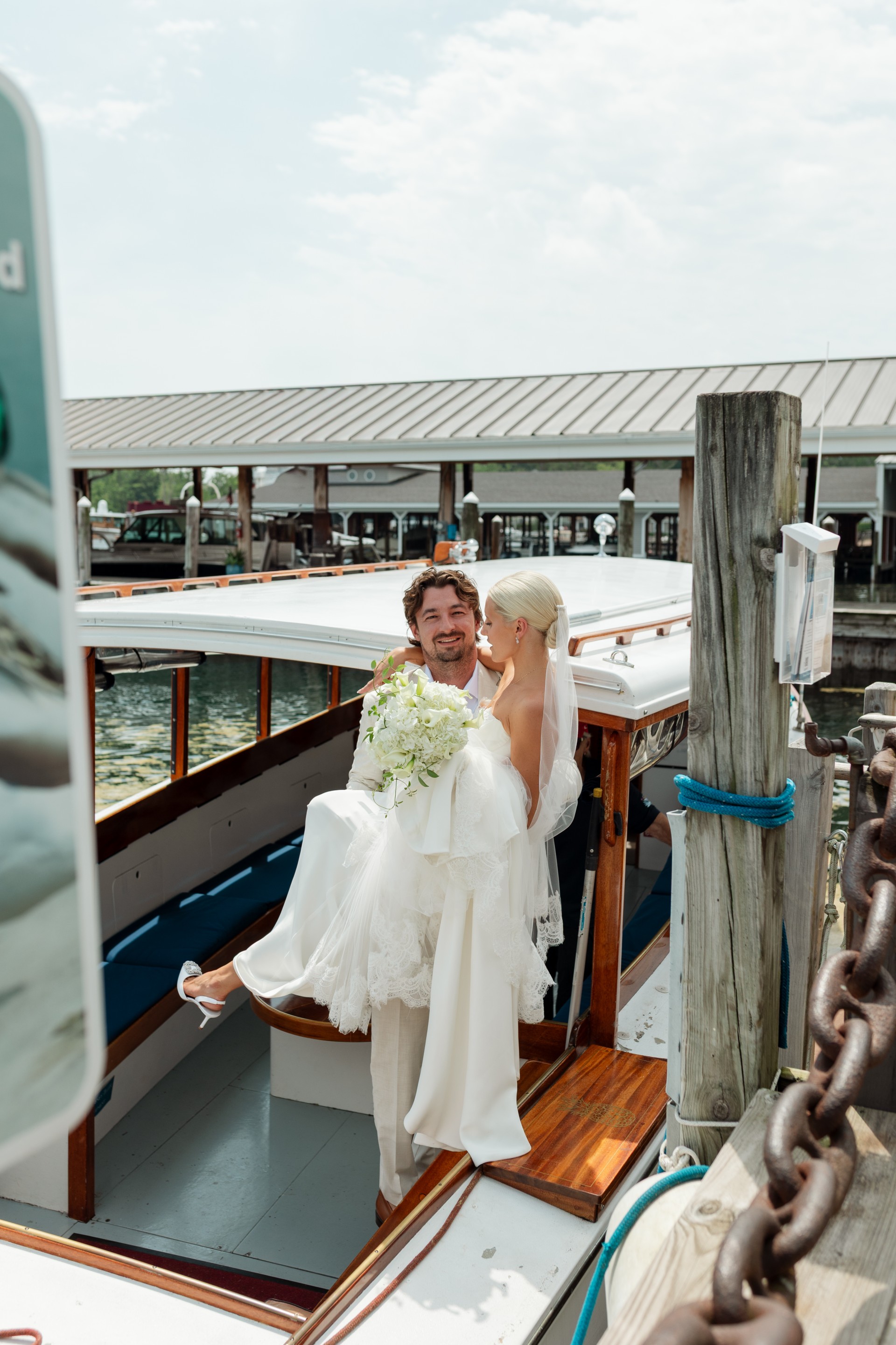 a man and woman in wedding dress on a boat