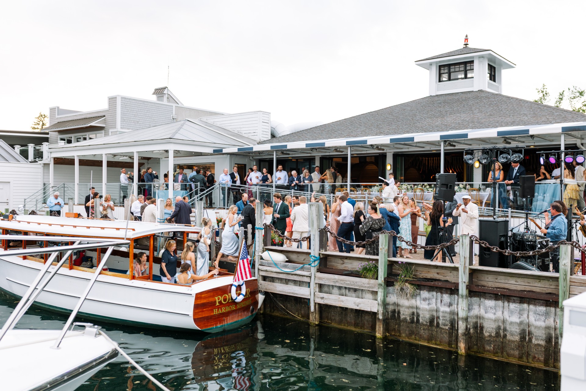 a group of people standing around a boat