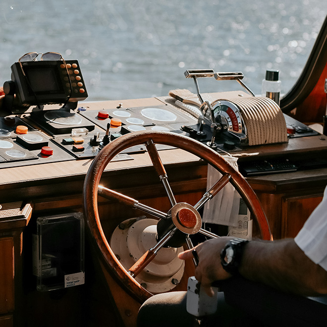 a man in a white shirt on a boat