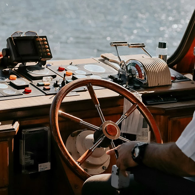 a man in a white shirt on a boat