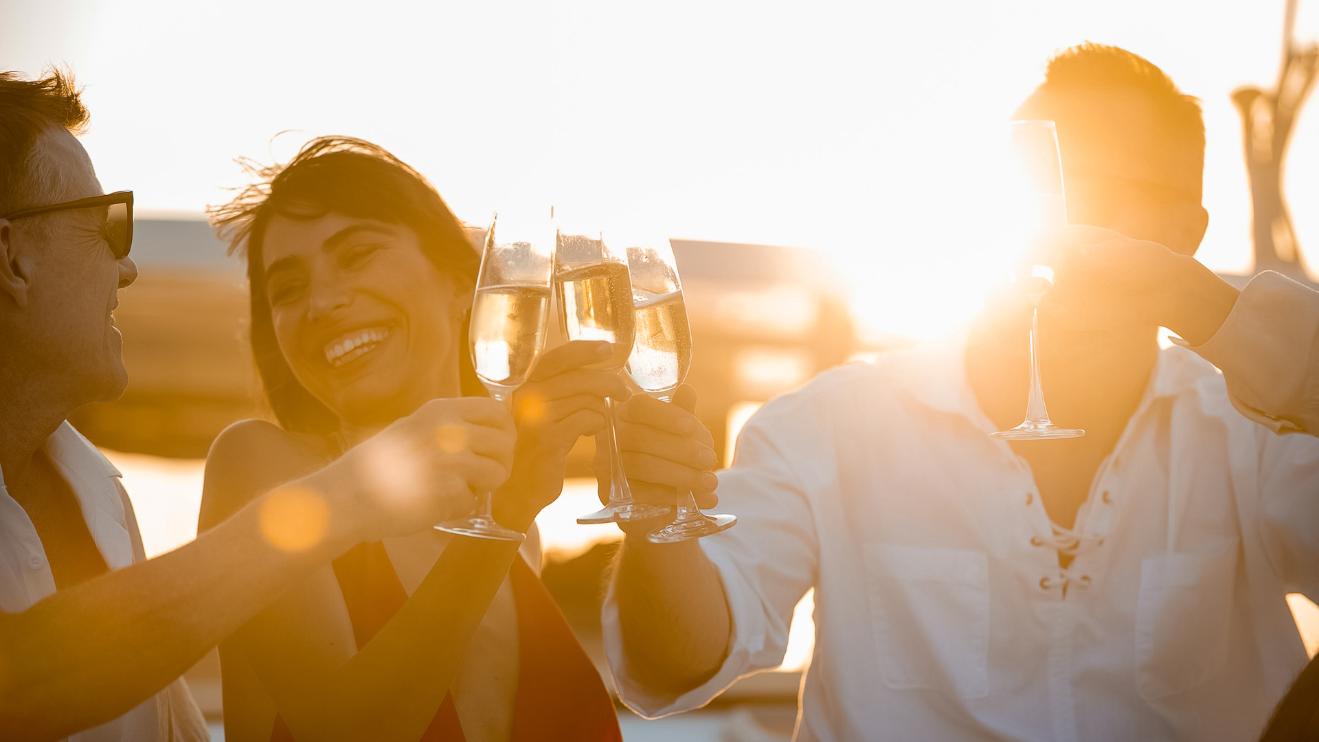 a group of people holding wine glasses