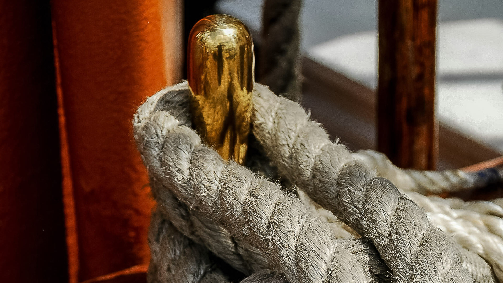 a rope with a gold object around it