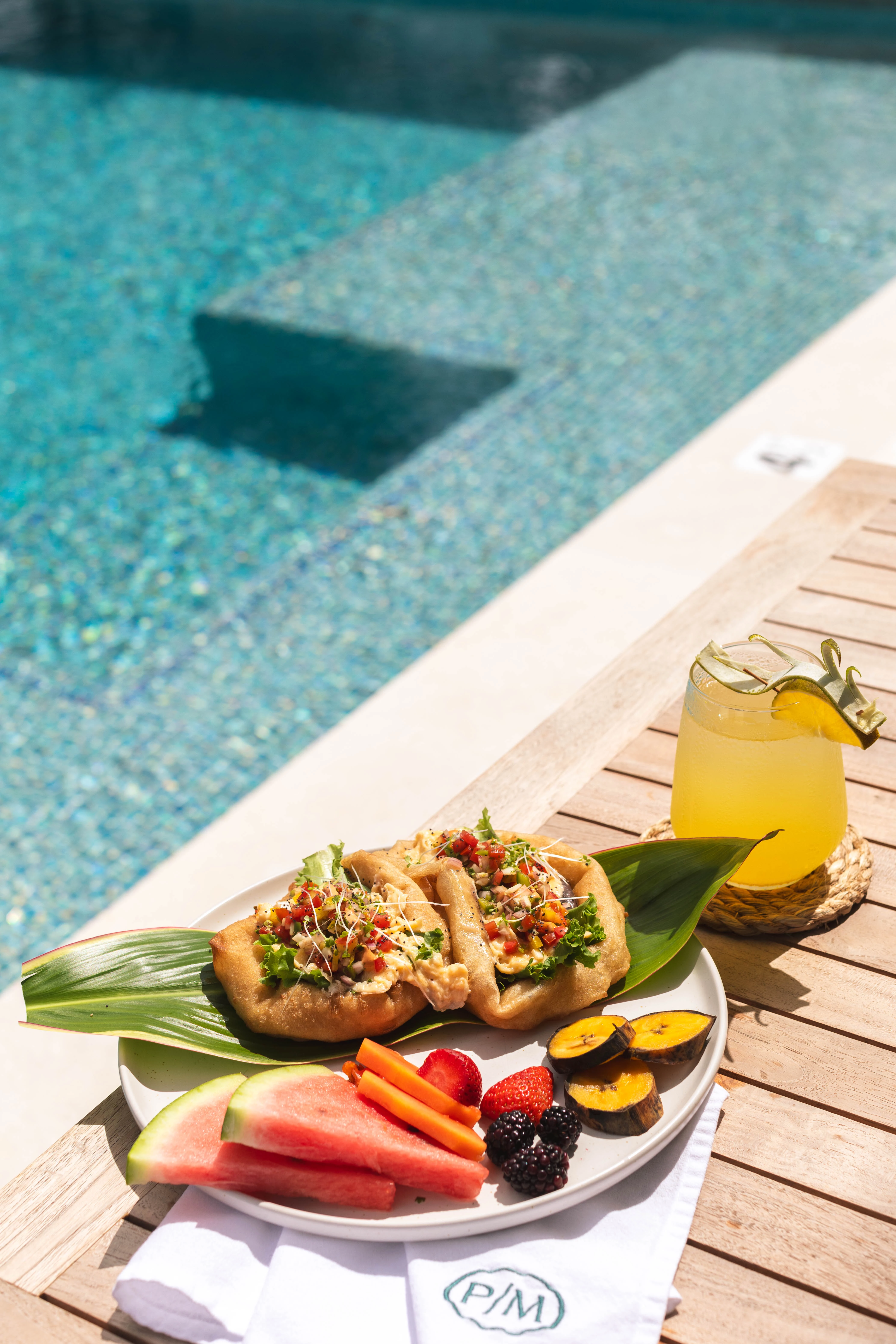 a plate of food next to a drink