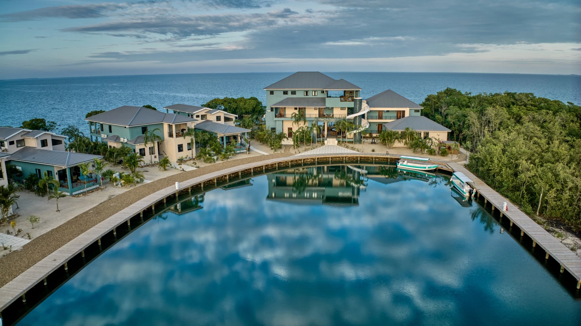 a body of water with houses and trees