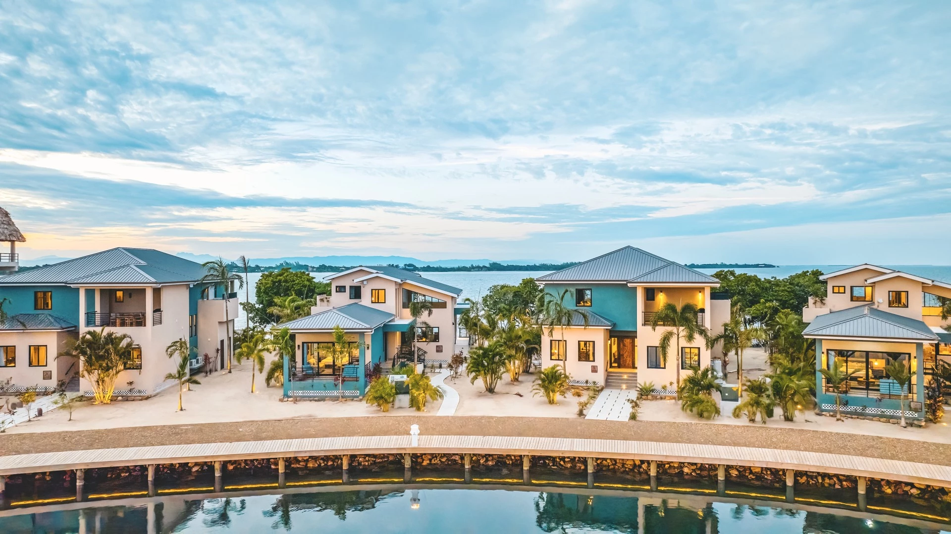 a group of houses next to a body of water