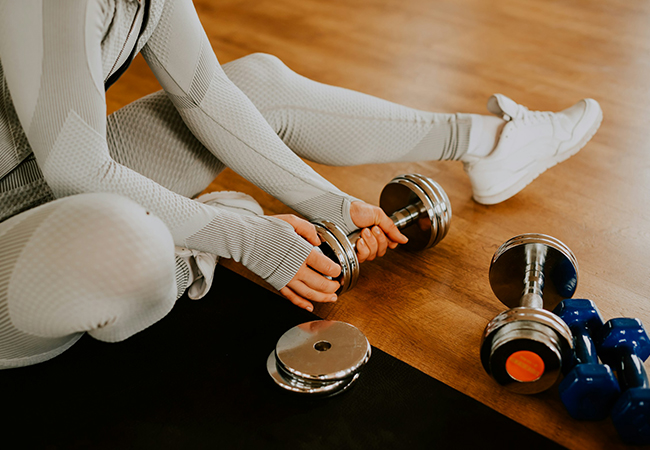 a person holding a dumbbell