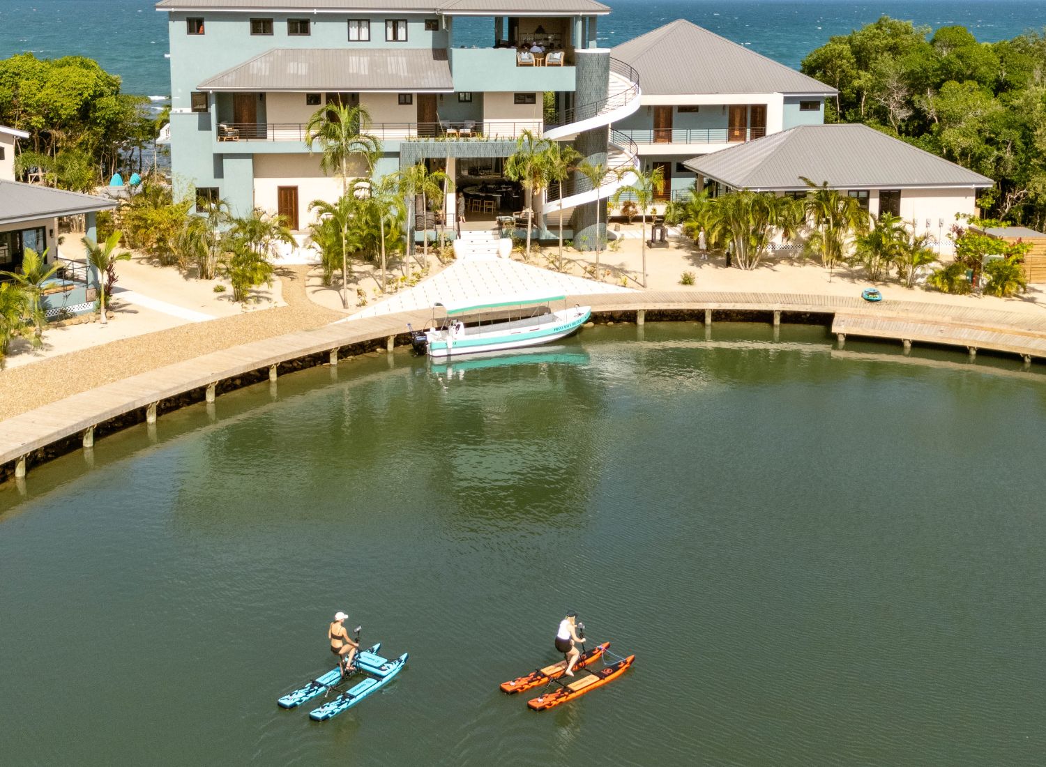 a couple of people on paddle boats in a body of water