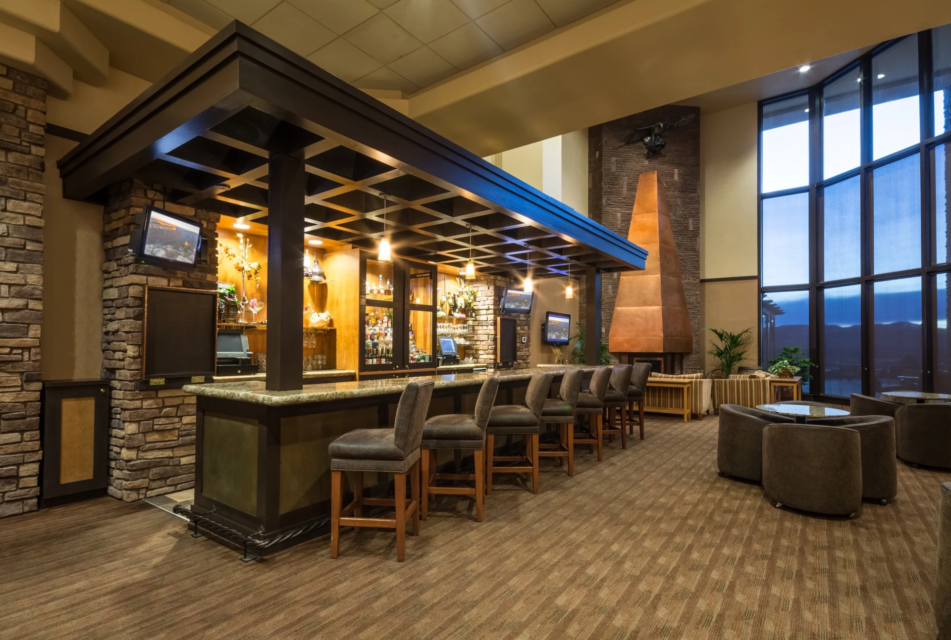 a bar with chairs and a table