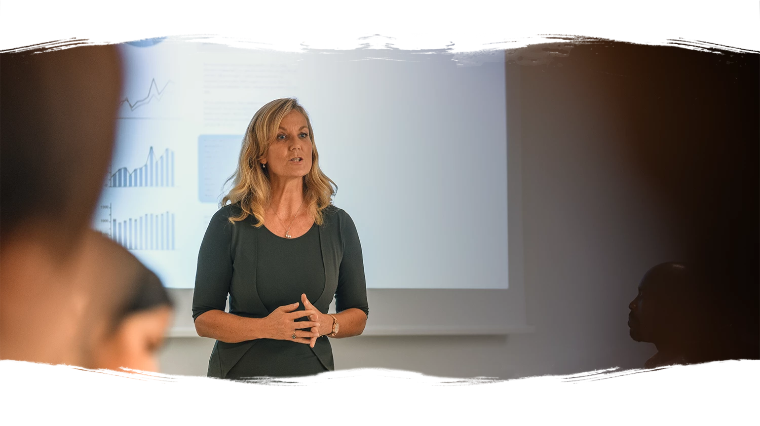 woman in front of projector presenting