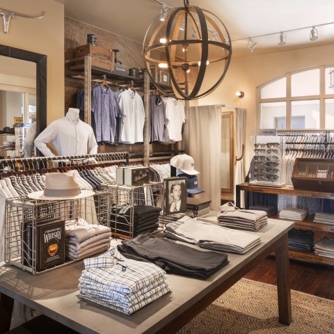 a store with a table of clothing