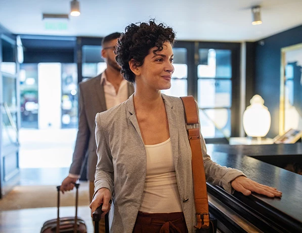 a woman arriving at the desk