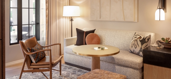 a living room with a couch and a lamp