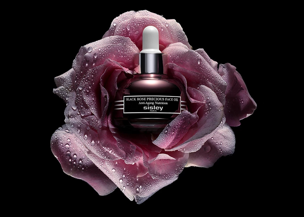 a bottle of oil in a rose