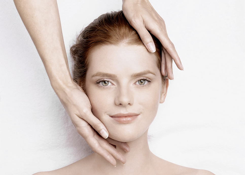 a woman with her hands on her face