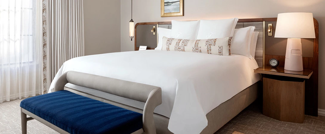 a bed with night table 