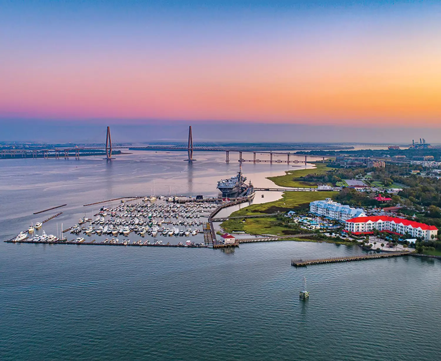 a body of water with a marina and a bridge and buildings