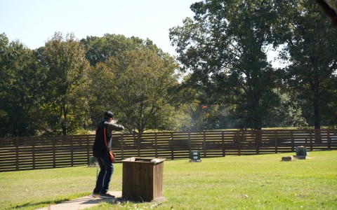 a man shooting a gun
