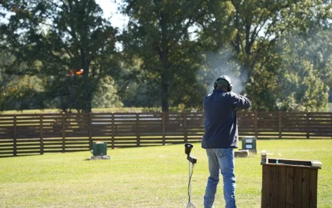 a man shooting a gun
