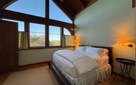 a bedroom with a large window
