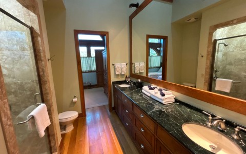 a bathroom with a large mirror and a sink