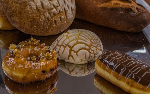 a group of pastries on a reflective surface