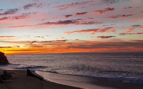 a sunset over a beach