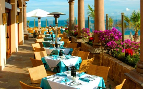 a restaurant with tables and chairs