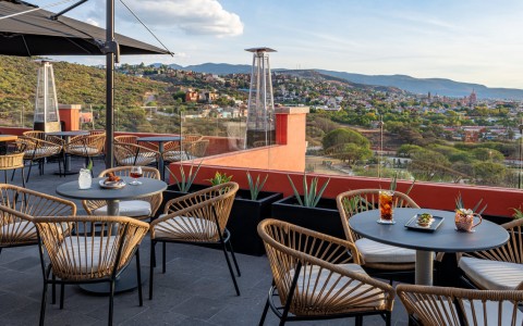 a table and chairs on a rooftop