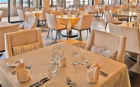 a restaurant with tables and chairs