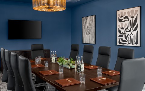 a conference room with a table and chairs