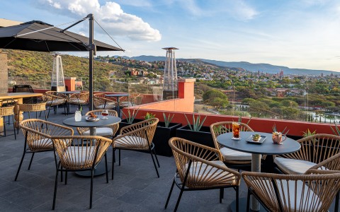 a table and chairs on a rooftop