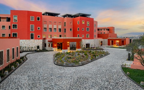 a building with a garden in front of it