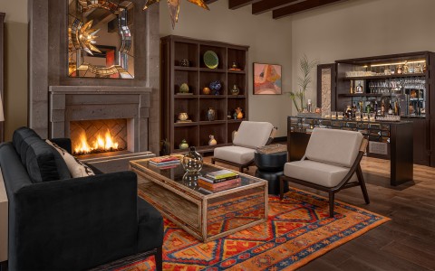 a living room with a fireplace and furniture