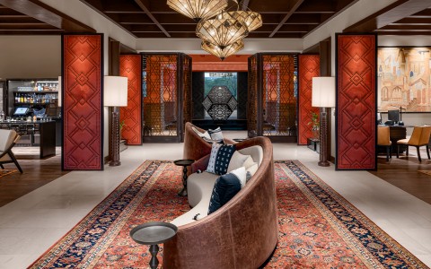 a room with a couch and a rug