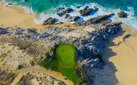 a golf course on a beach