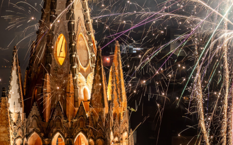 fireworks in the sky above a building