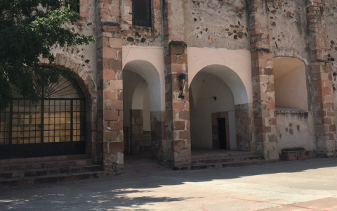 a stone building with arched doorways