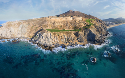 a large rocky island with a golf course on it