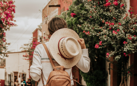 a person wearing a hat and backpack
