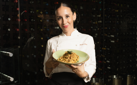 a woman holding a plate of food