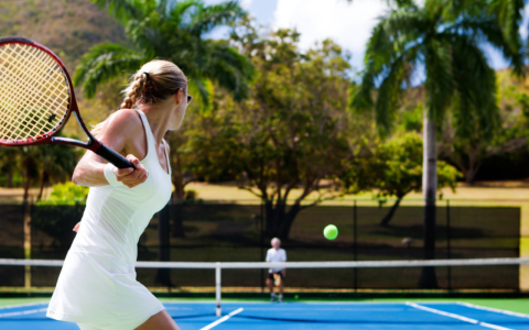 a woman swinging a tennis racket