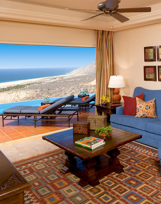 a living room with a pool table and couches