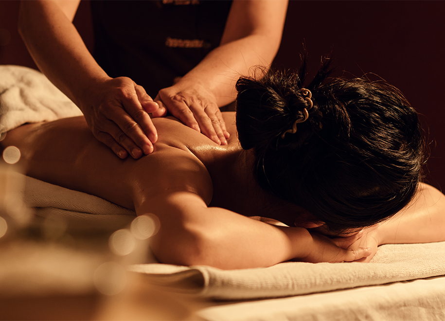 a woman lying down on a massage table