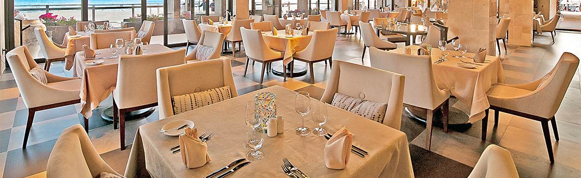 a restaurant with tables and chairs