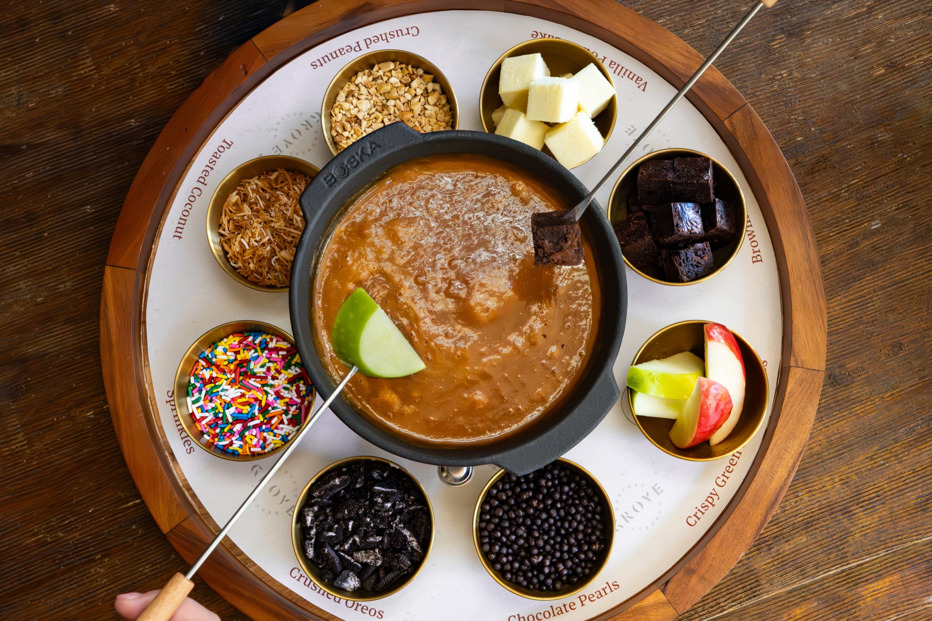 a fondue with different foods on a tray