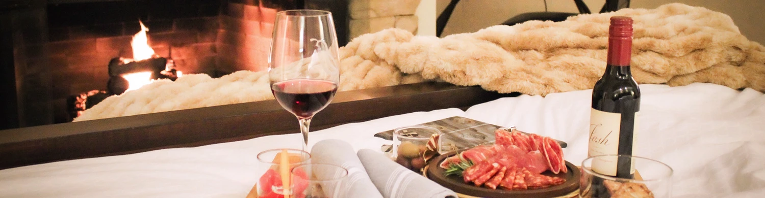 a glass of wine next to food